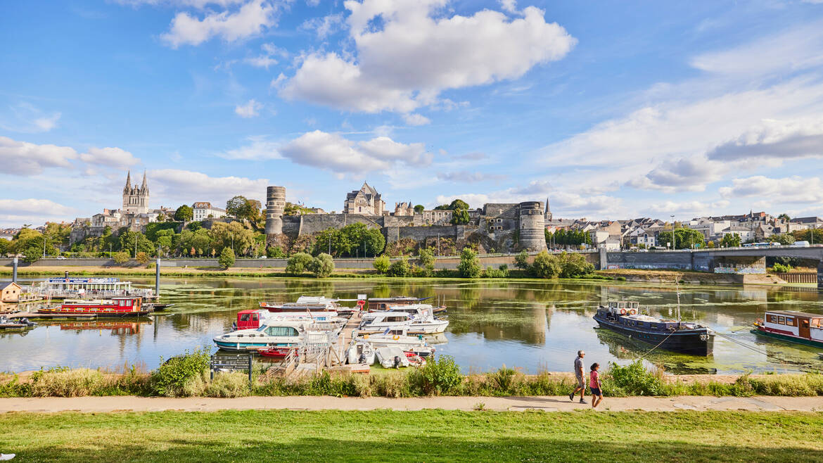 Wide shot of the port with a view of the castle and cathedral of Angers